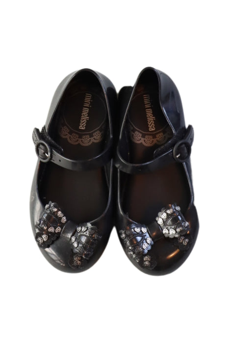 A Black Flats from Mini Melissa in size 4T for girl. (Back View)