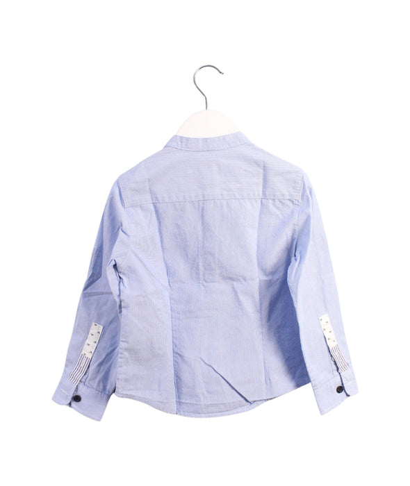 A Blue Shirts from Armani in size 4T for boy. (Back View)