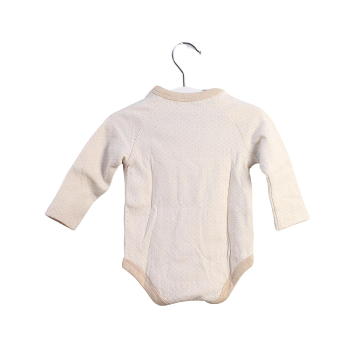 A Beige Bodysuits from Natures Purest in size 3-6M for girl. (Back View)