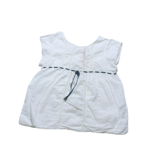 A White Sleeveless Tops from Bonpoint in size 4T for girl. (Front View)