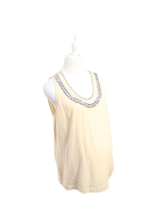 A Beige Sleeveless Tops from Diane Von Furstenberg in size M for maternity. (Front View)