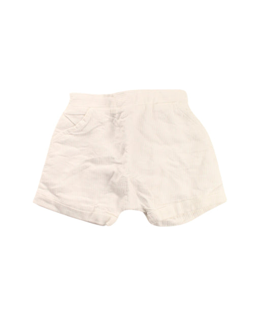 A White Shorts from Jacadi in size 6-12M for girl. (Front View)