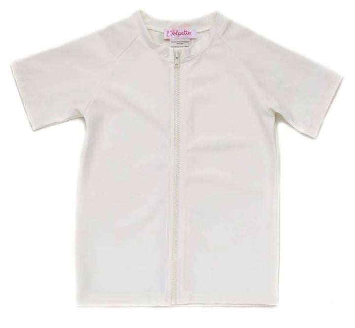 A White Rash Guards from Folpetto in size 6-12M for neutral. (Front View)