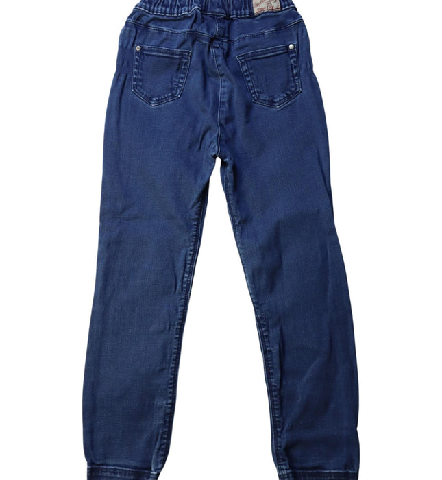 A Blue Jeans from Petit Bateau in size 6T for boy. (Back View)