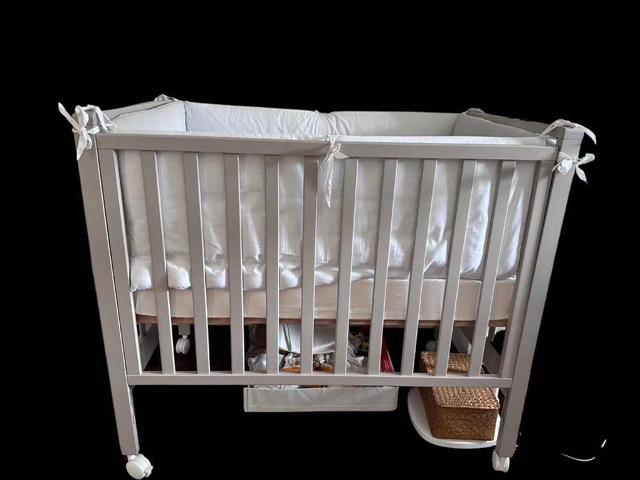 A White Cots & Cribs from Chicco in size 0-3M for neutral. (Back View)