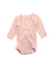 A Pink Long Sleeve Bodysuits from Petit Bateau in size 3-6M for girl. (Front View)