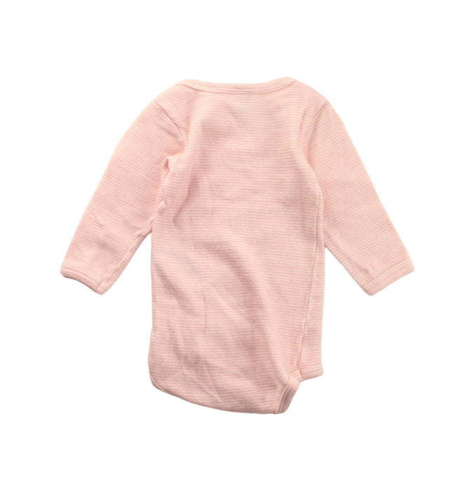 A Pink Long Sleeve Bodysuits from Petit Bateau in size 3-6M for girl. (Back View)