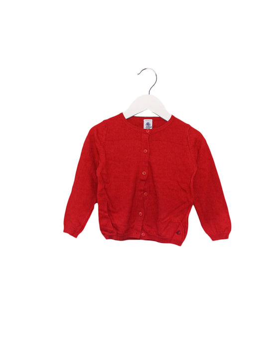 A Red Cardigans from Petit Bateau in size 4T for girl. (Front View)