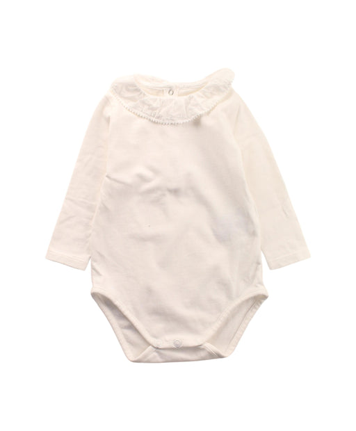A White Long Sleeve Bodysuits from Knot in size 3-6M for girl. (Front View)