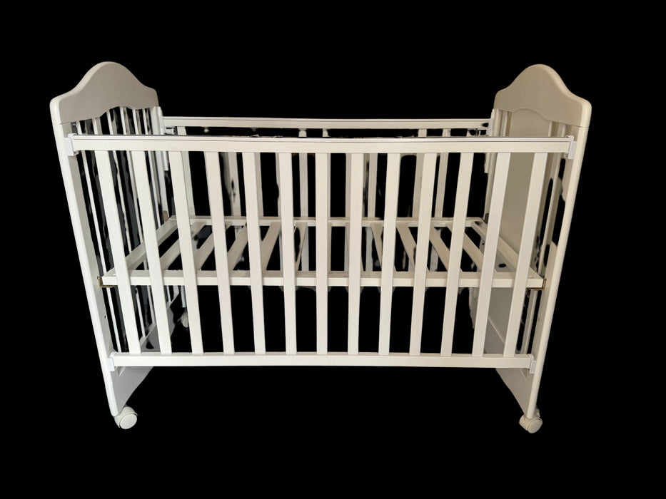 A White Cots & Cribs from LA Baby in size Newborn for neutral. (Back View)