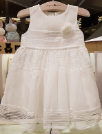 A White Sleeveless Dresses from Organic Mom in size 6-12M for girl. (Front View)