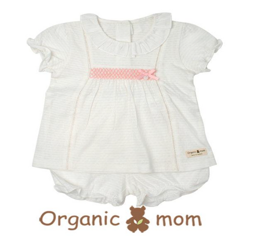 A White Pyjama Sets from Organic Mom in size 2T for girl. (Front View)