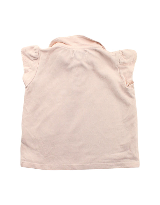 A Pink Short Sleeve Polos from Cyrillus in size 4T for girl. (Back View)