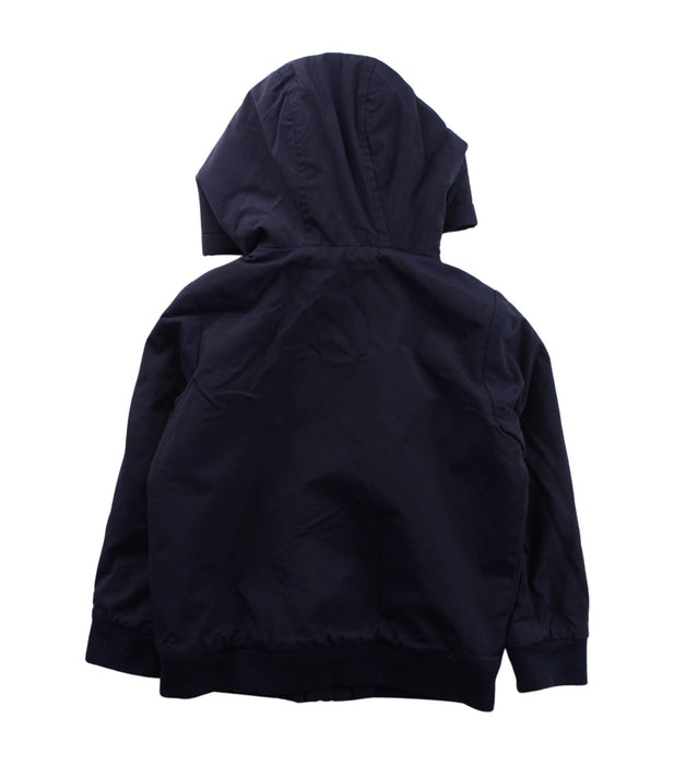A Blue Lightweight Jackets from Jacadi in size 4T for boy. (Back View)