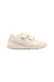 A White Sneakers from Puma in size 3T for girl. (Front View)