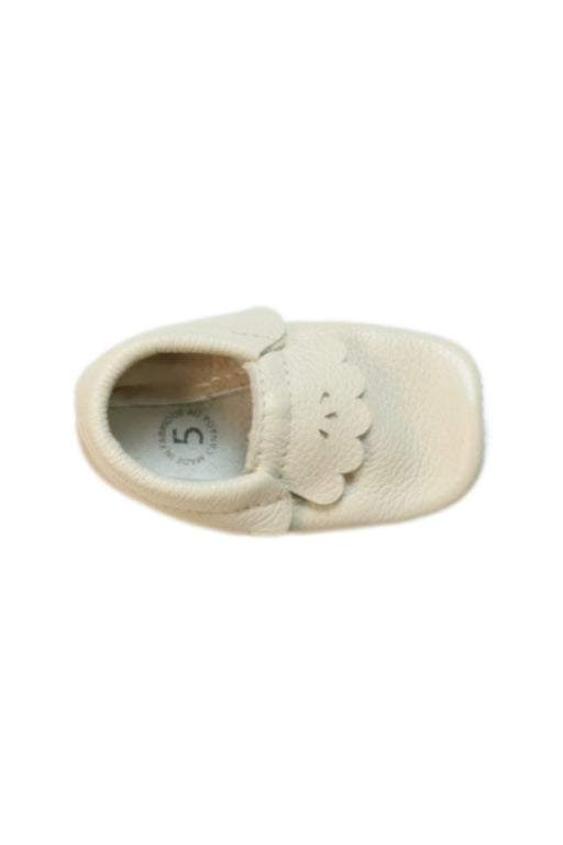 A White Slip Ons from heyfolks in size 18-24M for girl. (Front View)
