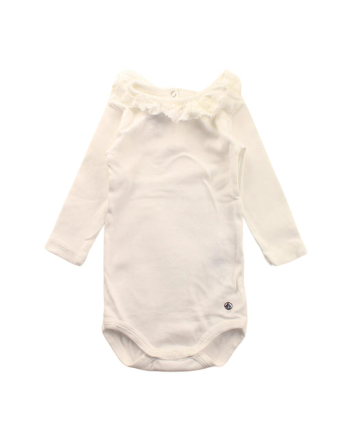 A White Long Sleeve Bodysuits from Petit Bateau in size 0-3M for girl. (Front View)