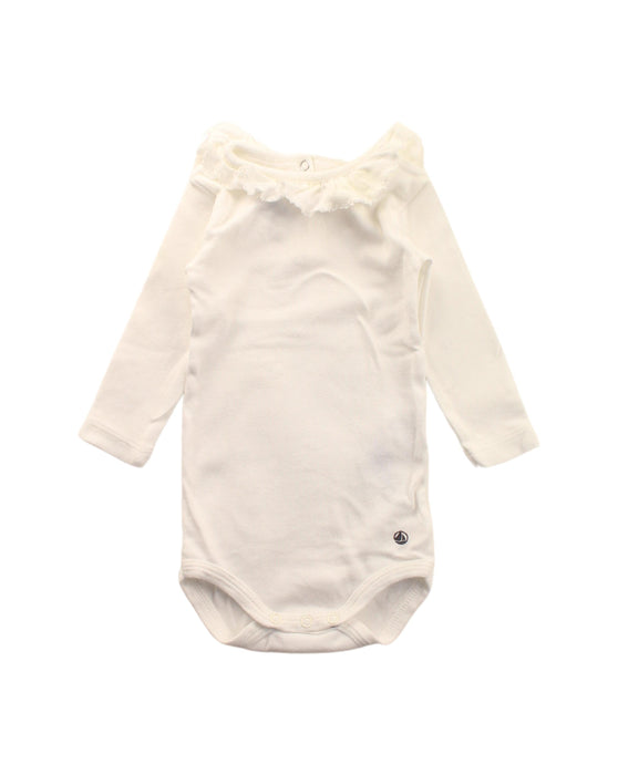 A White Long Sleeve Bodysuits from Petit Bateau in size 0-3M for girl. (Front View)
