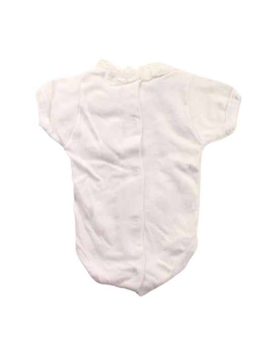 A White Short Sleeve Bodysuits from Babidu in size Newborn for girl. (Back View)