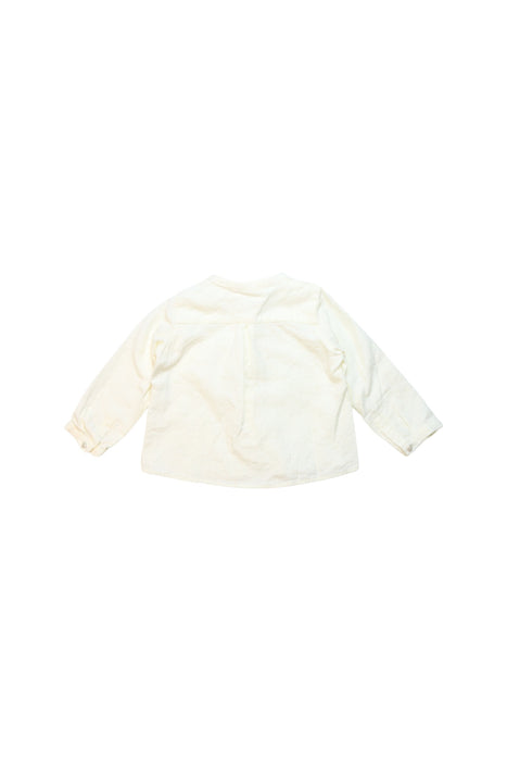 A Ivory Long Sleeve Shirts from Nanos in size 12-18M for boy. (Back View)