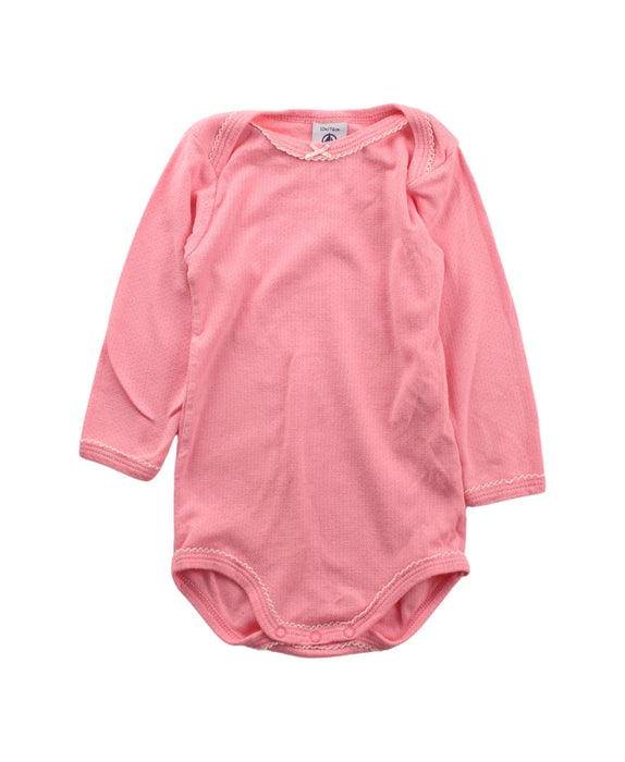 A Pink Long Sleeve Bodysuits from Petit Bateau in size 6-12M for girl. (Front View)