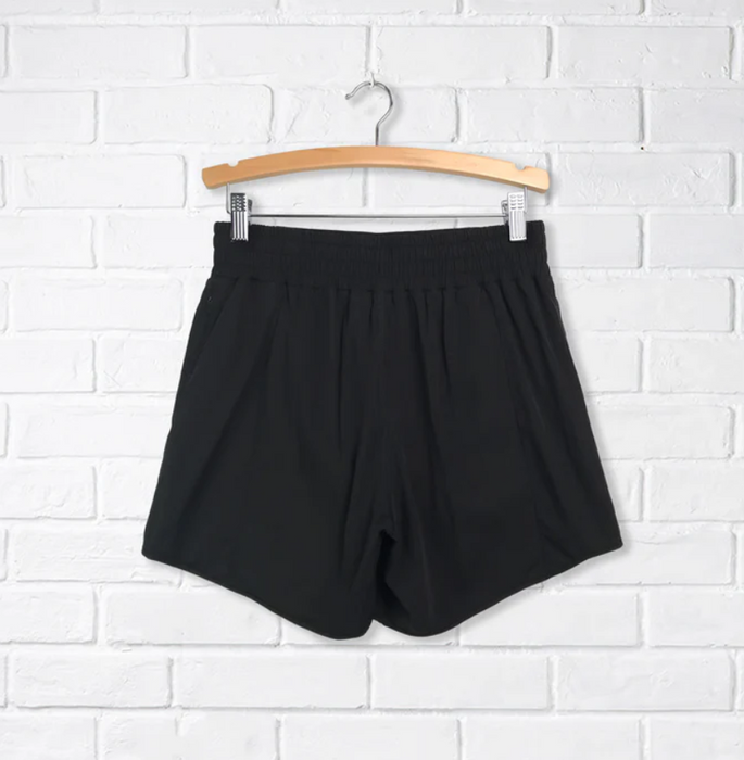 A Black Shorts from CDNIS in size 4T for girl. (Back View)