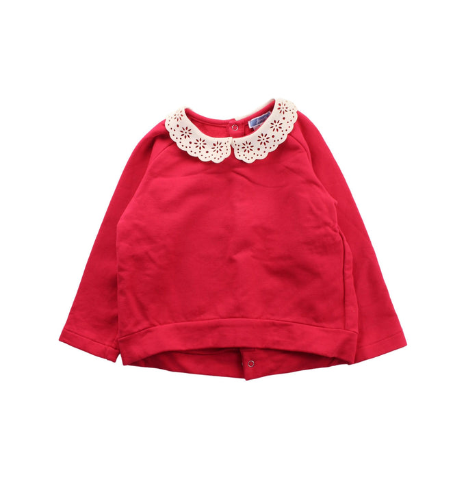 A Red Buttoned Sweatshirts from Jacadi in size 4T for girl. (Front View)