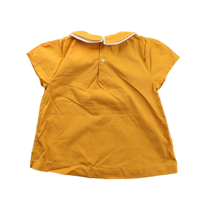 A Yellow Short Sleeve Dresses from Jacadi in size 5T for girl. (Back View)