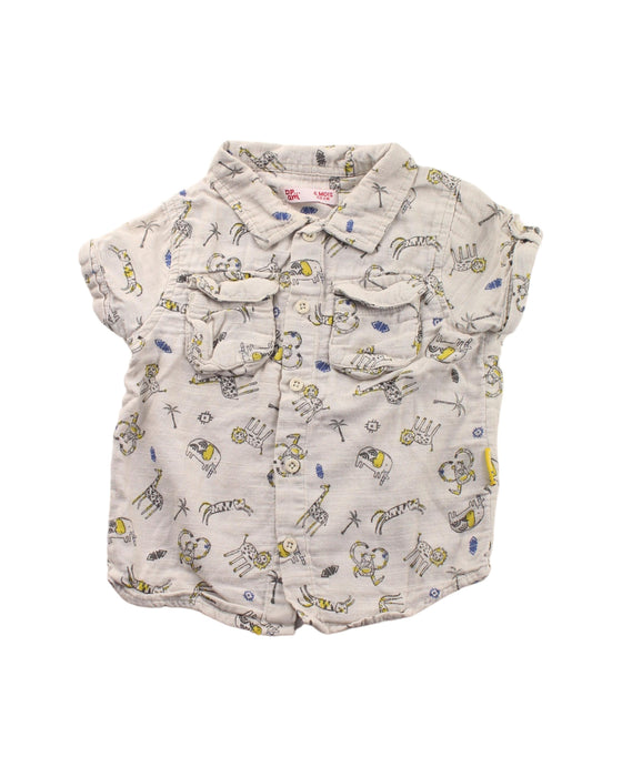 A White Short Sleeve Shirts from DPAM in size 3-6M for boy. (Front View)