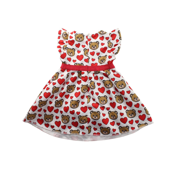 A White Short Sleeve Dresses from Moschino in size 6-12M for girl. (Back View)