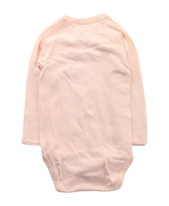 A Pink Long Sleeve Bodysuits from Petit Bateau in size 6-12M for girl. (Back View)