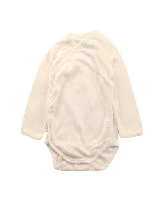 A White Long Sleeve Bodysuits from Petit Bateau in size 6-12M for neutral. (Front View)