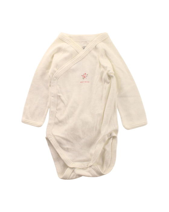 A White Long Sleeve Bodysuits from Petit Bateau in size 0-3M for girl. (Front View)