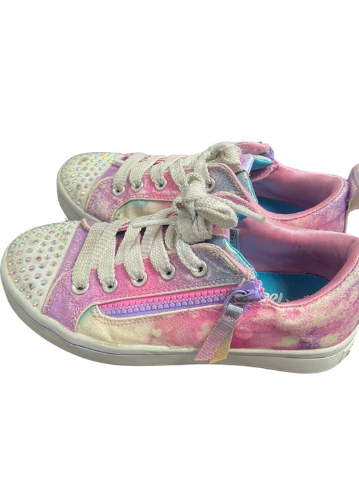 A Pink Sneakers from Skechers in size 7Y for girl. (Front View)