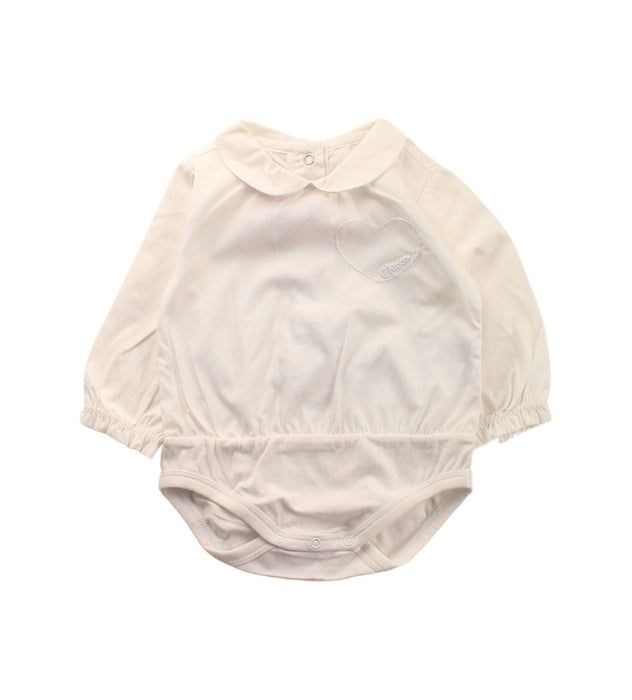 A White Long Sleeve Bodysuits from Chicco in size 0-3M for girl. (Front View)