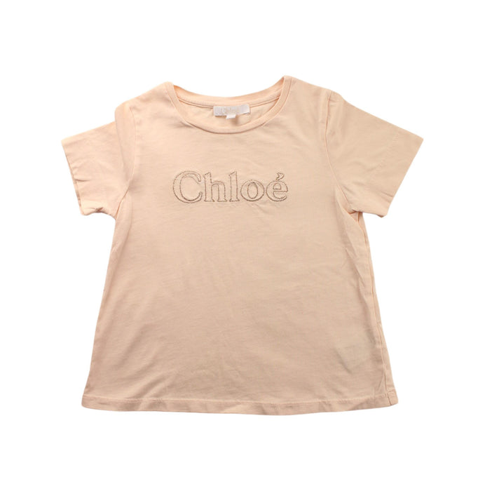 A Beige Short Sleeve T Shirts from Chloe in size 5T for girl. (Front View)