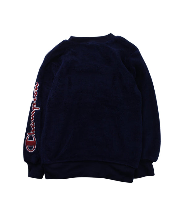 A Blue Crewneck Sweatshirts from Champion in size 7Y for boy. (Back View)