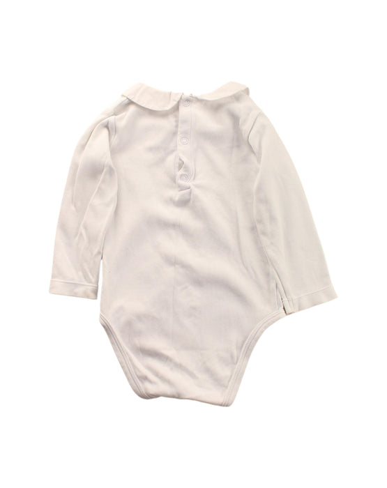 A White Long Sleeve Bodysuits from Jacadi in size 6-12M for girl. (Back View)