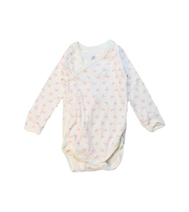 A White Long Sleeve Bodysuits from Petit Bateau in size 6-12M for girl. (Front View)