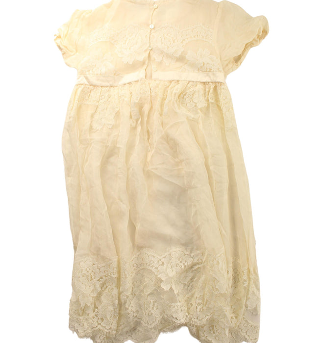 A Ivory Short Sleeve Dresses from Dolce & Gabbana in size 6T for girl. (Back View)