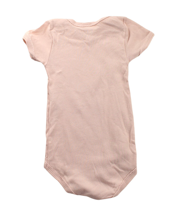 A Pink Short Sleeve Bodysuits from Petit Bateau in size 2T for girl. (Back View)