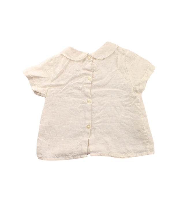 A White Short Sleeve Tops from Nanos in size 6-12M for girl. (Back View)