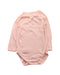 A Pink Long Sleeve Bodysuits from Petit Bateau in size 6-12M for girl. (Front View)