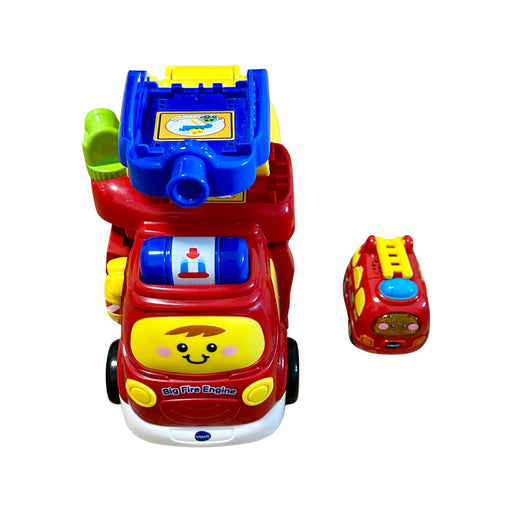 A Red Cars Trucks Trains & Remote Control from Vtech in size O/S for neutral. (Front View)