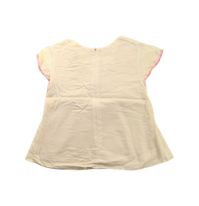 A Ivory Short Sleeve Dresses from Charabia in size 6T for girl. (Back View)