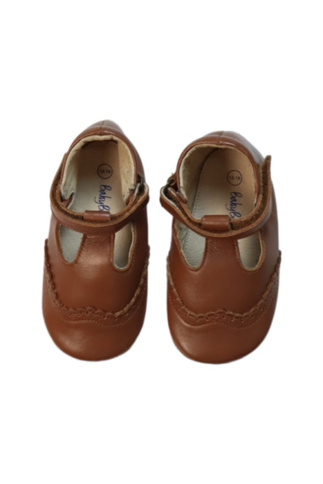 A Brown Flats from Boden in size 12-18M for girl. (Back View)