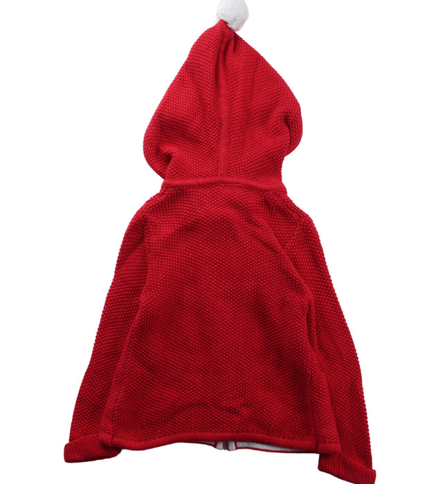 A Red Coats from The Little White Company in size 6-12M for neutral. (Back View)