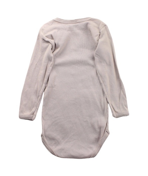 A Beige Long Sleeve Bodysuits from Petit Bateau in size 12-18M for girl. (Back View)