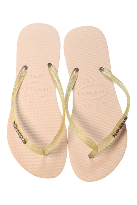 A Beige Flip Flops from Havaianas in size 11Y for girl. (Back View)