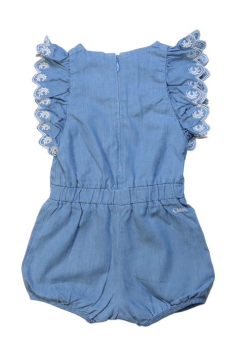 A Blue Short Sleeve Rompers from Chloe in size 3-6M for girl. (Back View)